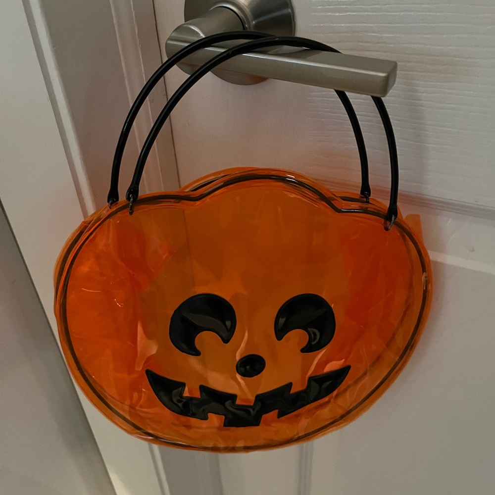 Fabulous plastic pumpkin trick or treat purse.  Metal handles.